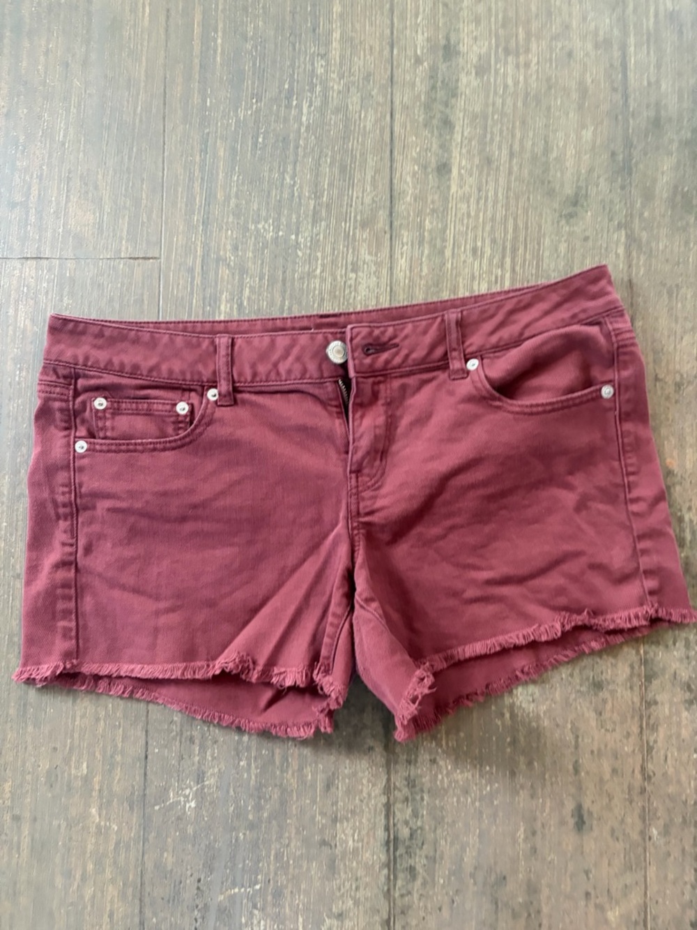 American Eagle Women’s Frayed Hem Shorts in Burgundy